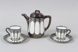 A ROSENTHAL PORCELAIN SILVER MOUNTED TEAPOT AND TWO CUPS AND SAUCERS.