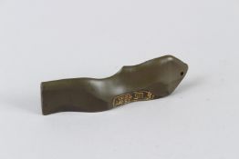 A SMALL CHINESE CARVED GREEN STONE SEAL. 10cms long.