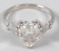 AN 18CT WHITE GOLD AND DIAMOND RING, set with a heart shaped diamond.