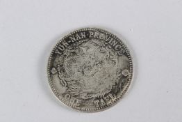 A CHINESE WHITE METAL COIN. 45cms diameter.
