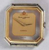 BAUME & MERCIER, a stainless steel and gilt metal quartz wristwatch, lacking strap. 26mm wide.