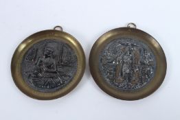 TWO INDIAN TANJORE SILVER INLAID BRASS DISHES. 8.5cms diameter