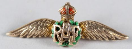 A 9CT GOLD AND ENAMEL RAF BROOCH. 4cms wide.