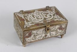 A 19TH CENTURY SYRIAN SILVER AND COPPER INLAID BRASS BOX. 11cms wide.