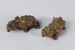 A PAIR OF ORIENTAL BRONZE MYTHICAL BEASTS. 9cms long.