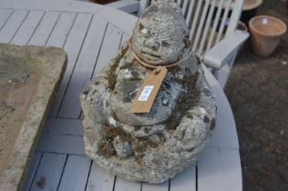 A pair of reconstituted stone garden ornaments modelled as seated Buddha.