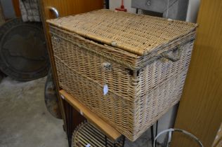 A wicker hamper and two baskets.