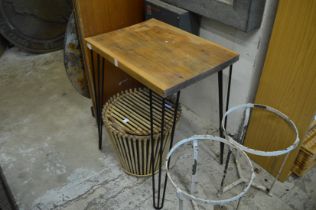 A pine and wrought iron occasional table.