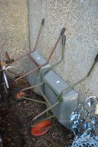 Two galvanised wheelbarrows.