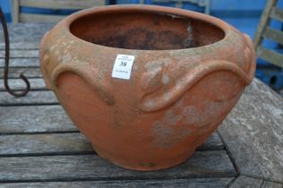 An Art Nouveau style terracotta planter.