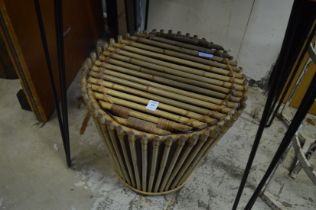 A bamboo waste paper basket.