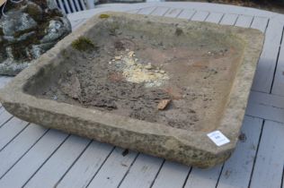 Reconstituted stone square shaped bird bath.