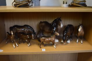 A collection of Beswick horses.
