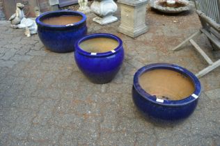 Three large turquoise glazed planters.