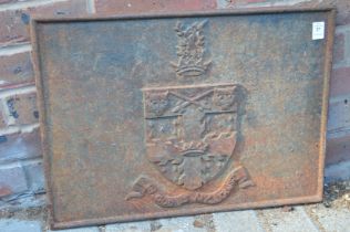 A small cast iron fireback.