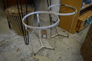 A pair of wrought iron stands.