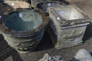 Two reconstituted stone garden pots.