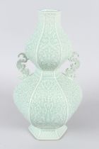 A FINE CHINESE CELADON CARVED "BAT AND FLORAL" HEXAGONAL DOUBLE GOURD VASE. 35cms high.