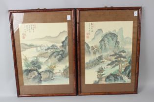 A PAIR OF CHINESE WATERCOLOUR LANDSCAPE PICTURES with mountains, waterfalls and trees. Signed with