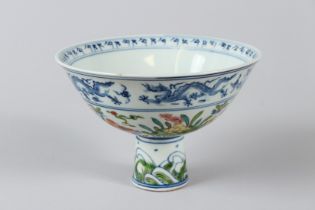 A CHINESE POLYCHROME STEM CUP. 4.5ins high.