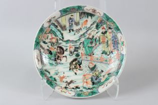 A GOOD CHINESE FAMILLE ROSE CIRCULAR DISH painted with many figures. 6.5ins diameter.