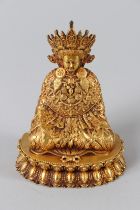 A TIBETAN GILT ALLOY FIGURE OF JOWO SHAKYAMUNI on an oval base. 4ins high. Weight 867.5ozs.