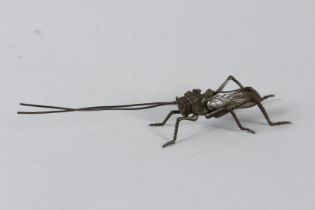 A JAPANESE BRONZE ARTICULATED LONGHORN BEETLE. 6ins high.