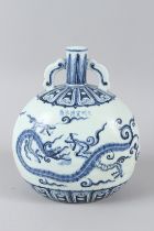 A CHINESE BLUE AND WHITE DRAGON MOONFLASK. 10ins high.