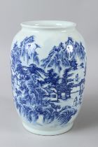 A CHINESE BLUE AND WHITE VASE with buildings, figures and trees. 10.5ins high.