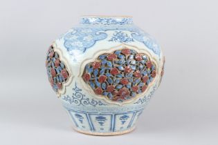 A FINE CHINESE BLUE AND WHITE CARVED "FLORAL AND RUYI" JAR. 35cms high.