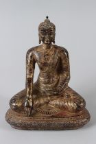 A GILT BRONZE SHAKYAMUNI BUDDHA. 8ins high.