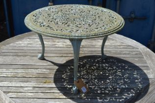 A green painted aluminium circular coffee table.