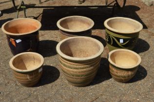 Six glazed flower pots.