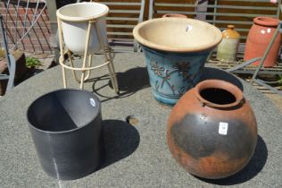 A blue glazed plant pot and three other items.