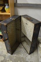 An old wardrobe trunk.