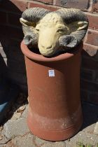 A terracotta chimney pot and a composite rams head wall pocket.