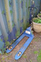 A hydraulic pallet truck.