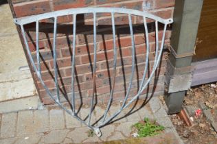 A galvanised metal hay manger.