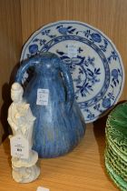 A small Chinese blanc de chine figure of Guan Yin together with a three handled vase and a plate.