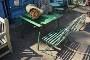Green painted folding table and four chairs (faults).