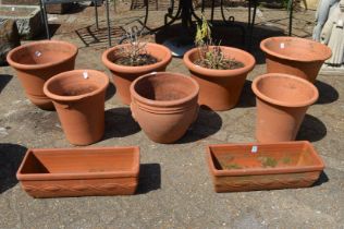A good collection of terracotta plant pots and troughs.