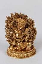 A SINO-TIBETAN GILT BRONZE FIGURE OF YAMANTAKA, the bull-headed deity embracing his consort,