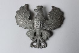 A PRUSSIAN HELMET PLATE. MIT GOTT FUR KOENIG UND VATERLAND. 4.5ins wide.