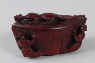 A CHINESE OVAL JADE POT AND COVER the lid and sides with leopards 6 ins long
