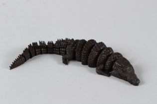A JAPANESE BRONZE ARTICULATED CROCODILE. 7ins long.