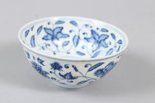 A CHINESE BLUE AND WHITE BOWL scrolling floral design 4.5ins diameter.