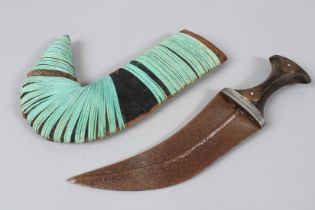 A JAMBIYA (ARABIC) CURVED DAGGER worn in Yemen.