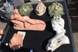 Six small garden ornaments.