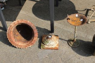 A cast iron bird table and a Victorian cast iron vase (AF).