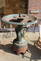 A large cast iron fountain with motor. The base holding three storks. 3ft 9ins high x 3ft 7ins